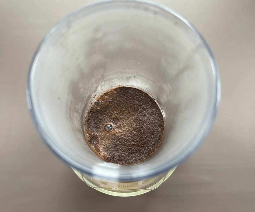 Blooming coffee grounds in the AeroPress during brewing