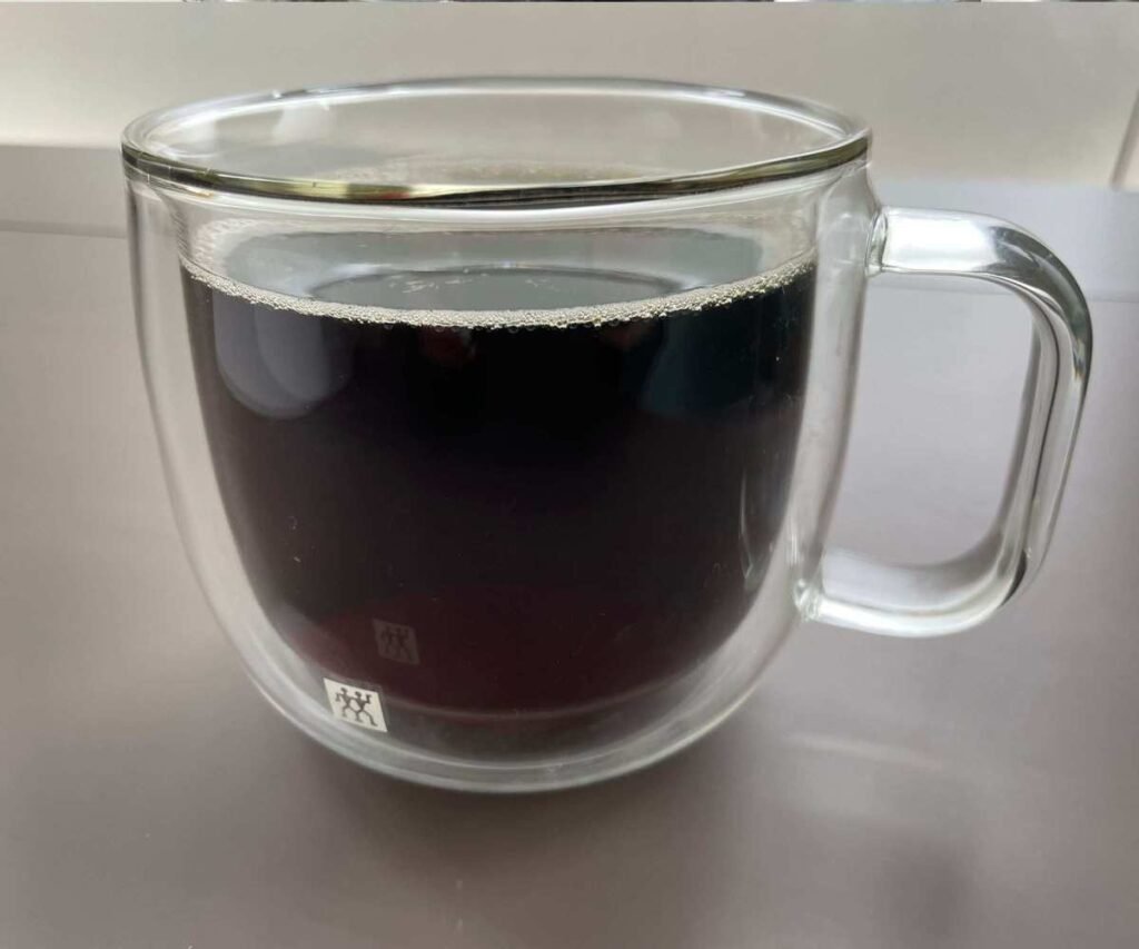 A cup of coffee brewed using the AeroPress